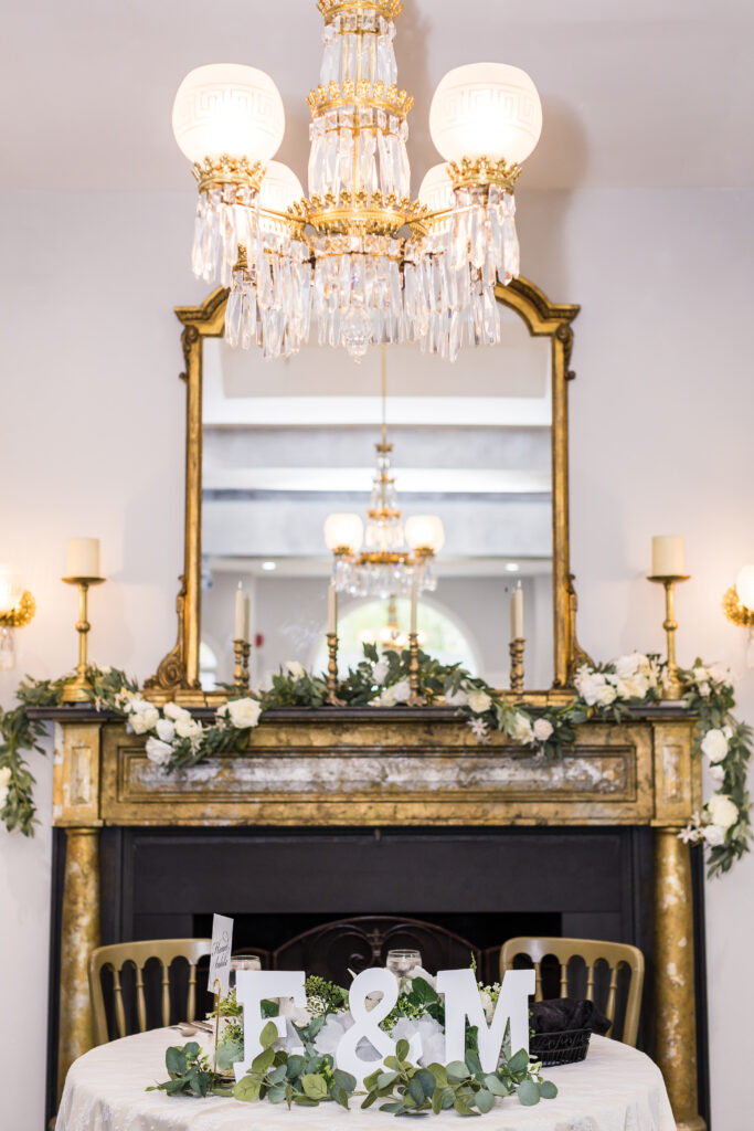 Grand Ballroom at Ceresville Mansion featuring chandeliers, tall ceilings, and elegant gold accents for wedding receptions.