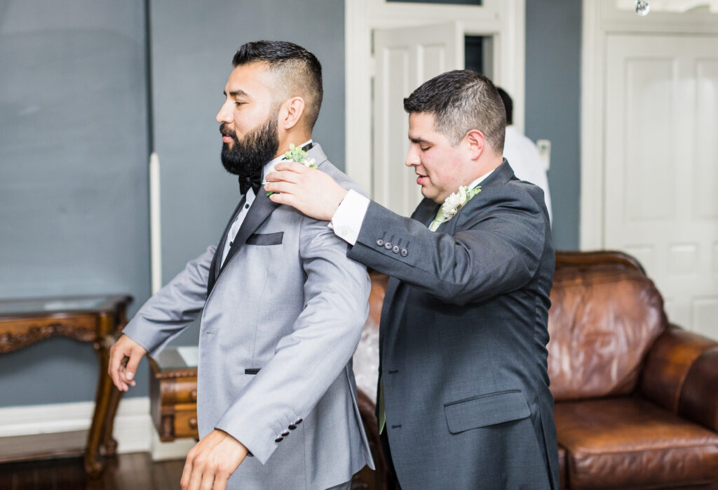Elegant groom’s suite at Ceresville Mansion with classic decor and natural light.