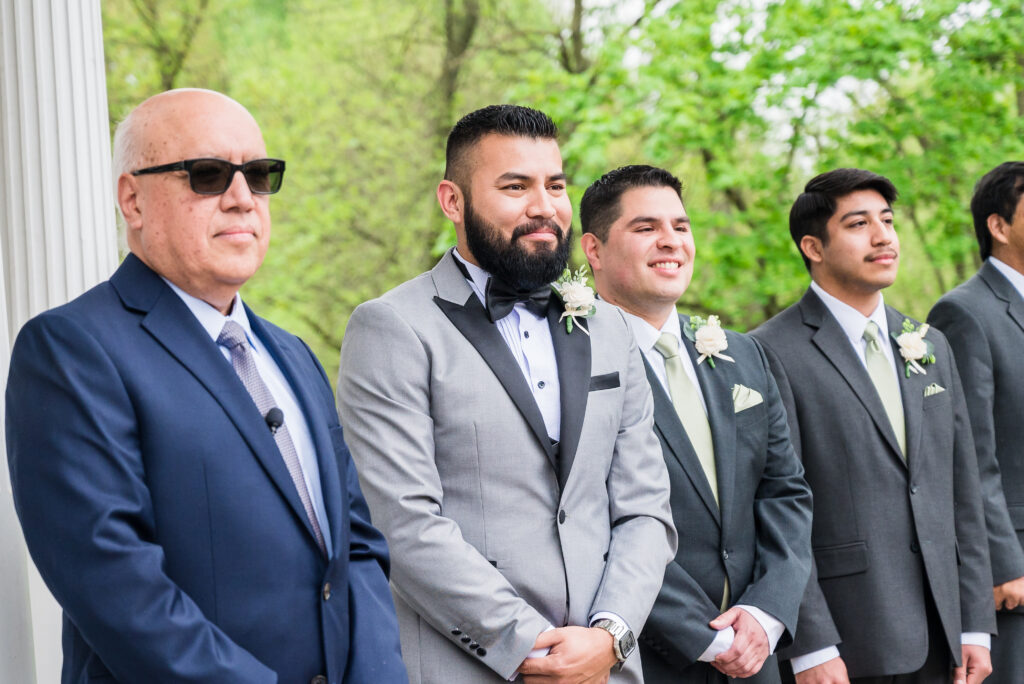 Outdoor Christian wedding ceremony on the Garden Terrace at Ceresville Mansion surrounded by lush greenery.