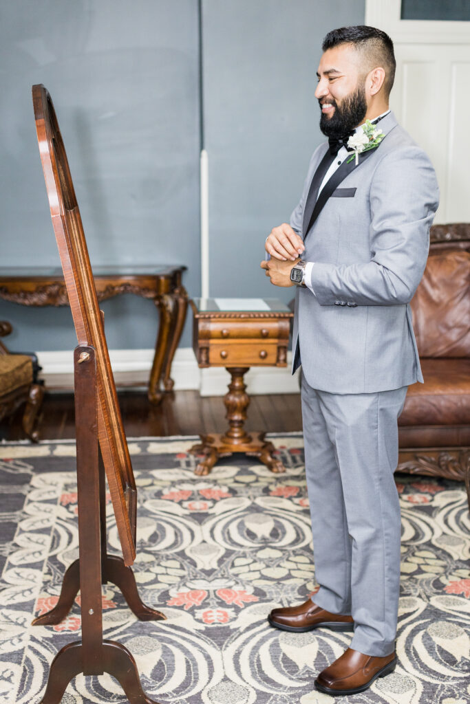 Elegant groom’s suite at Ceresville Mansion with classic decor and natural light.