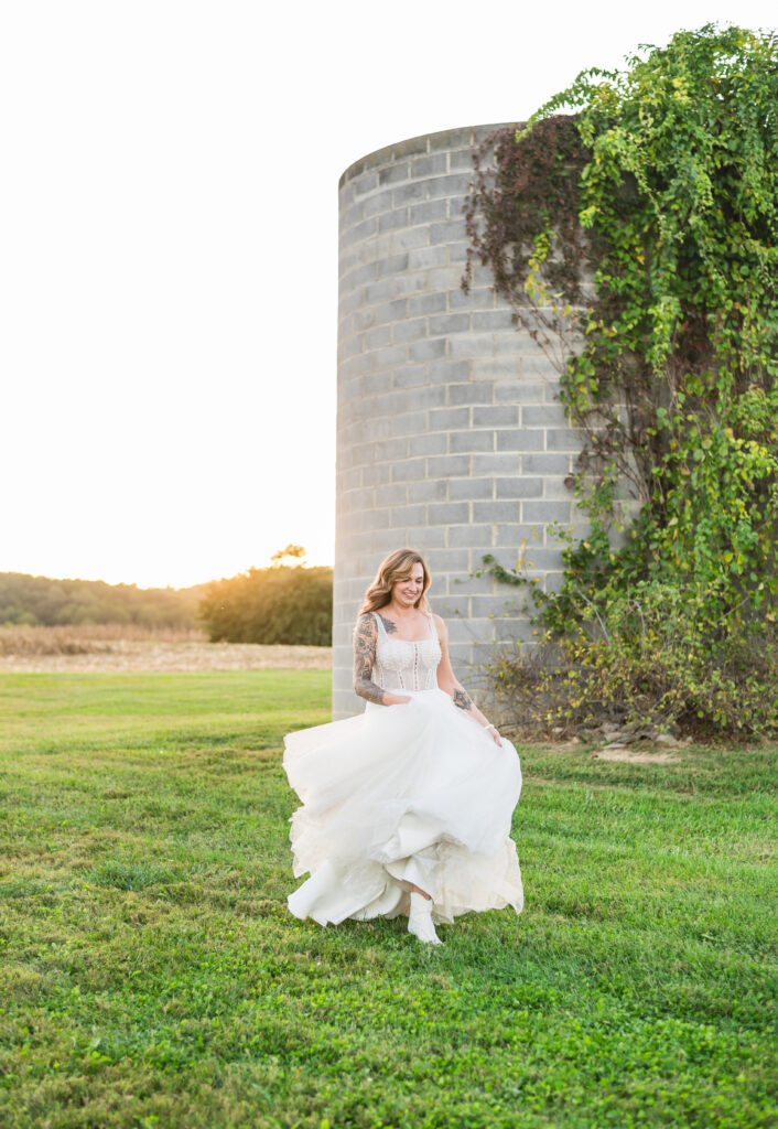 Wedding dress details captured beautifully - flowing gown, dramatic train, and delicate beading on a bride