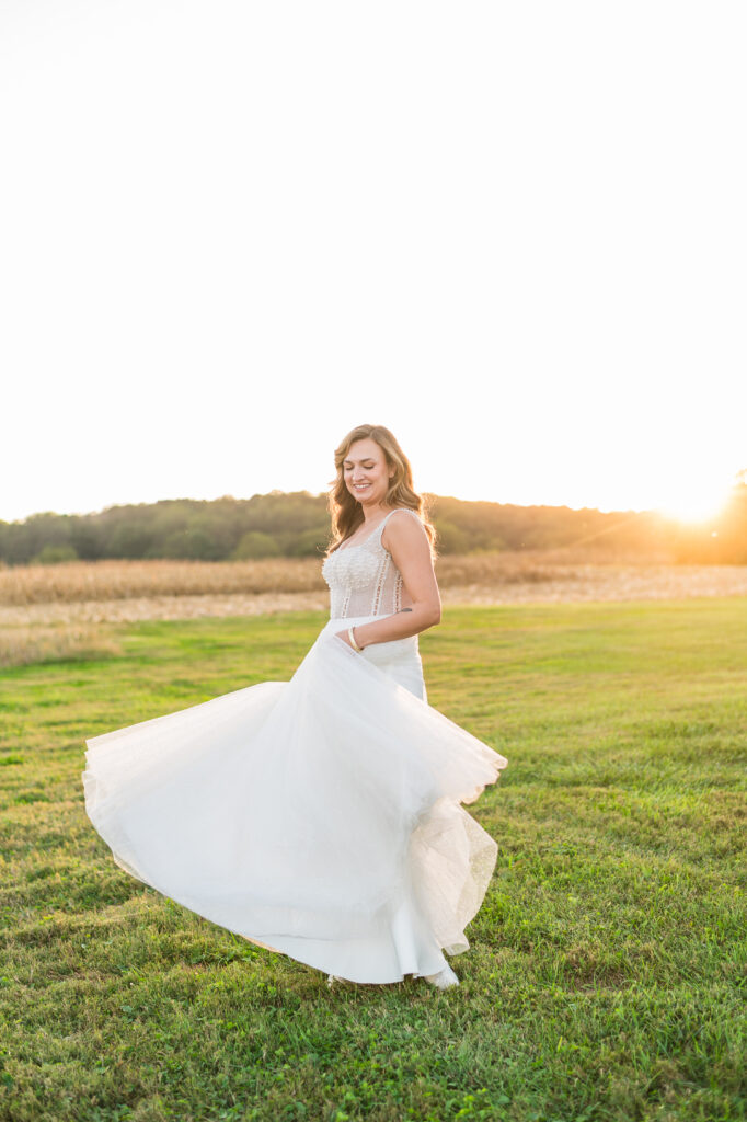 Wedding dress details that photograph well - bride in a flowing gown with lace and statement sleeves