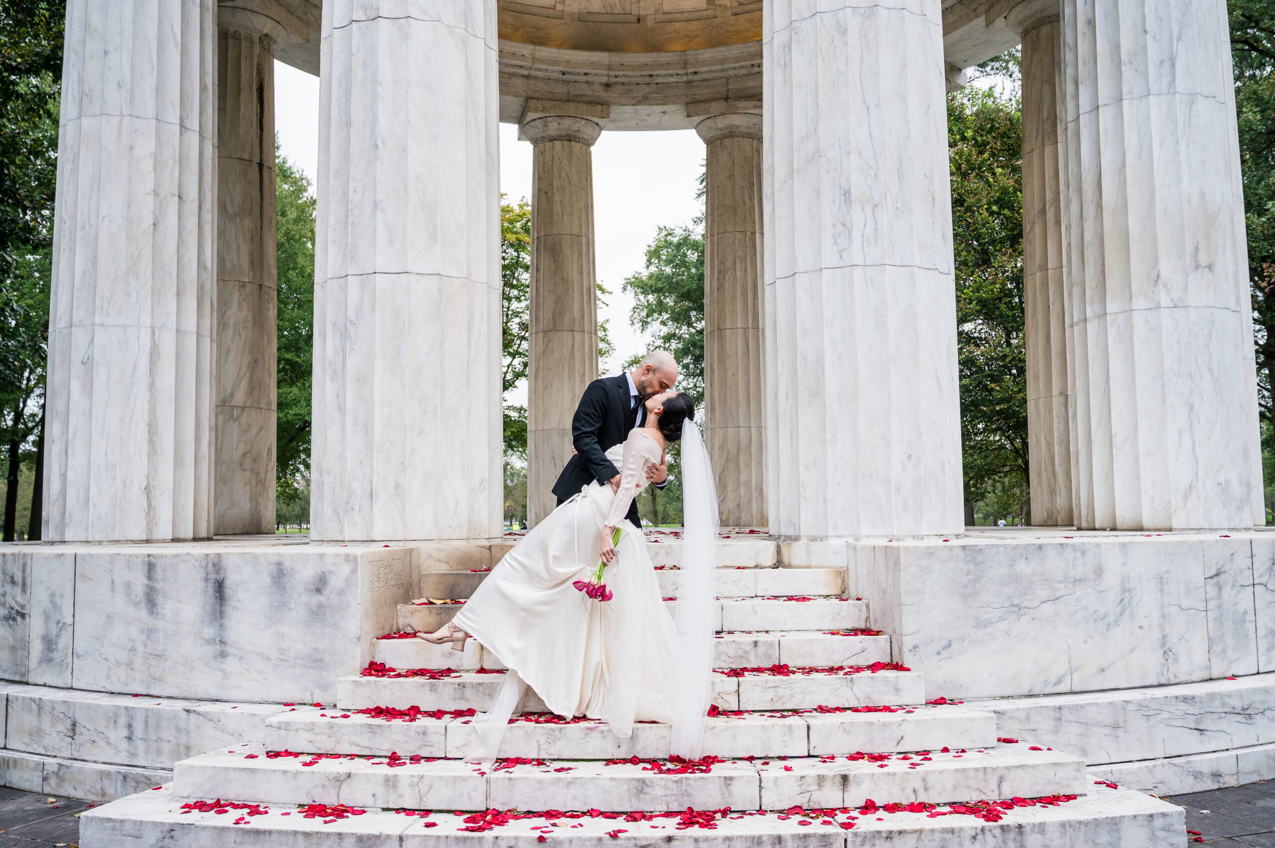 Bride and groom at the DC War Memorial during their intimate Washington DC wedding