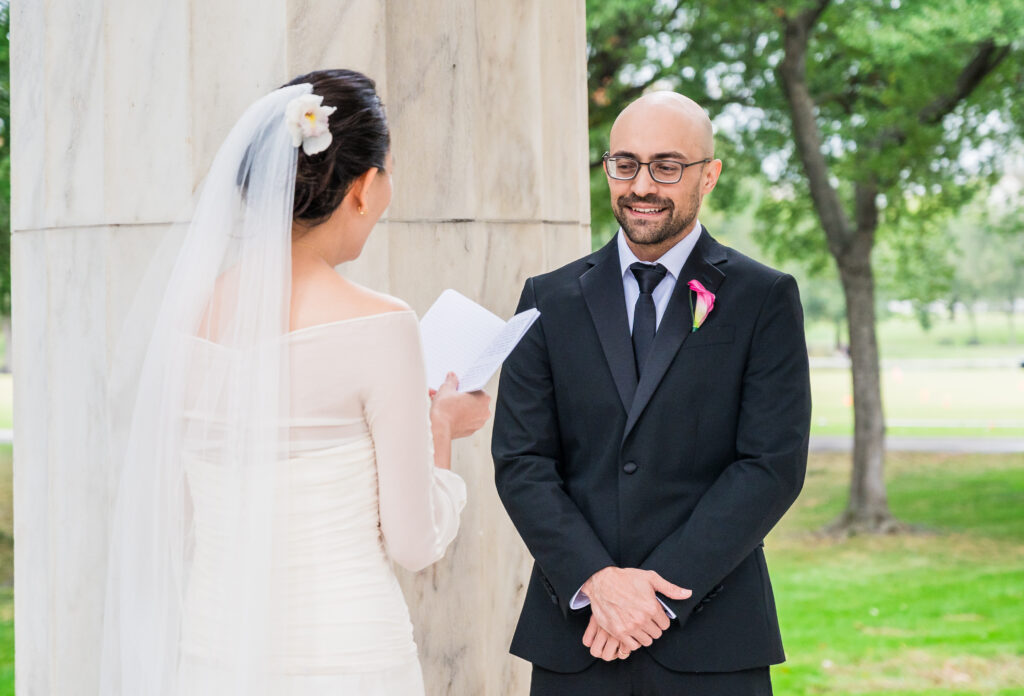 Groom emotional during wedding vows.