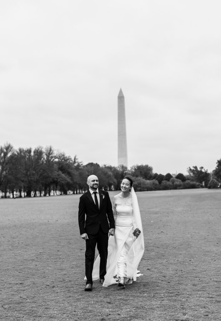 Wedding portraits of couple with the Washington Monument in the background.