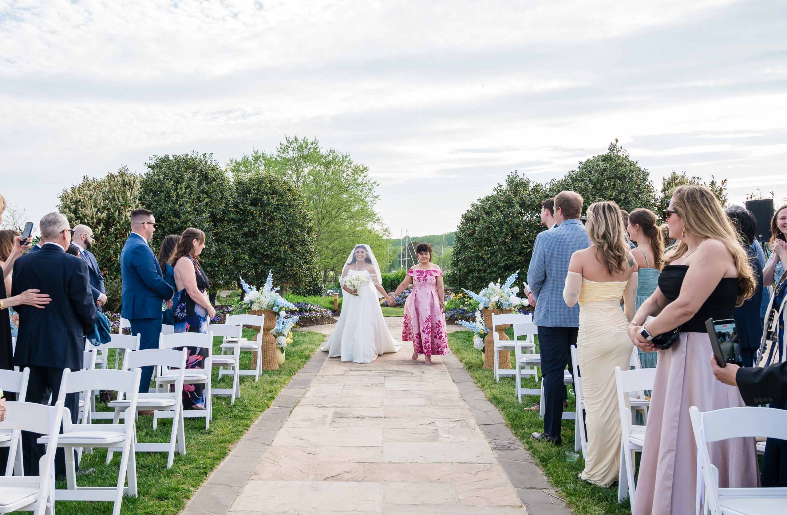 Bride walking down the aisle at wedding ceremony at Herrington on the Bay