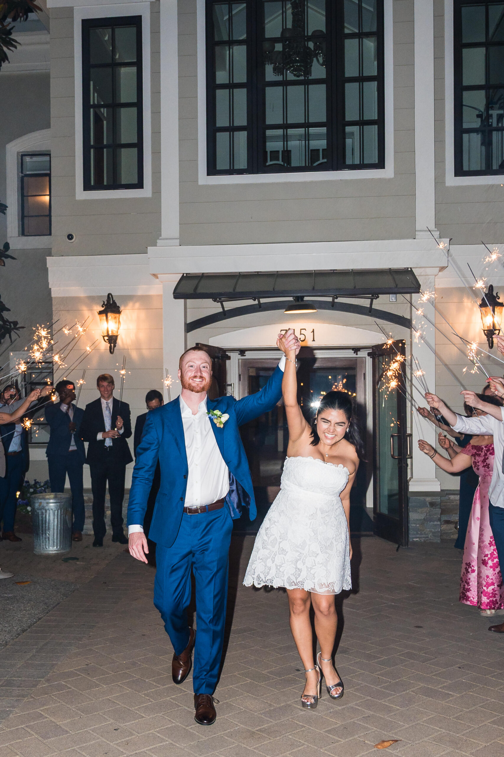 Bride and groom celebrating sparkler exit at Herrington on the Bay in North Beach Maryland