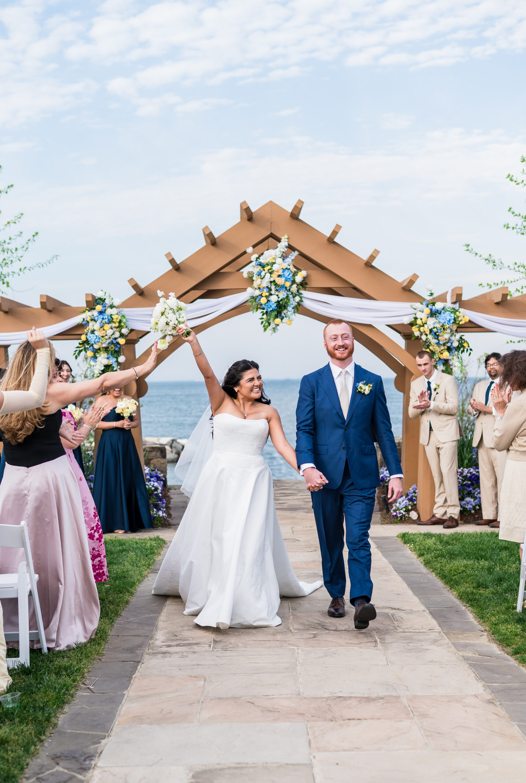 Couple celebrating after their wedding ceremony at Herrington on the Bay in Maryland