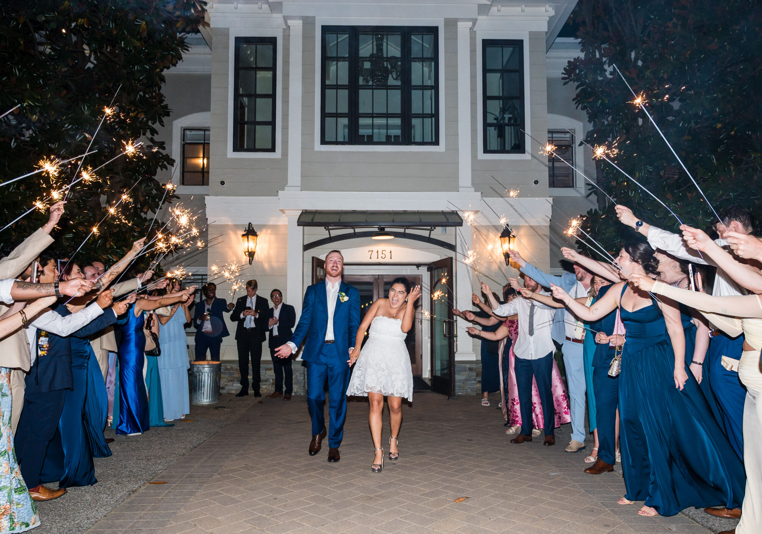 Bride and groom celebrating sparkler exit at Herrington on the Bay venue in North Beach Maryland