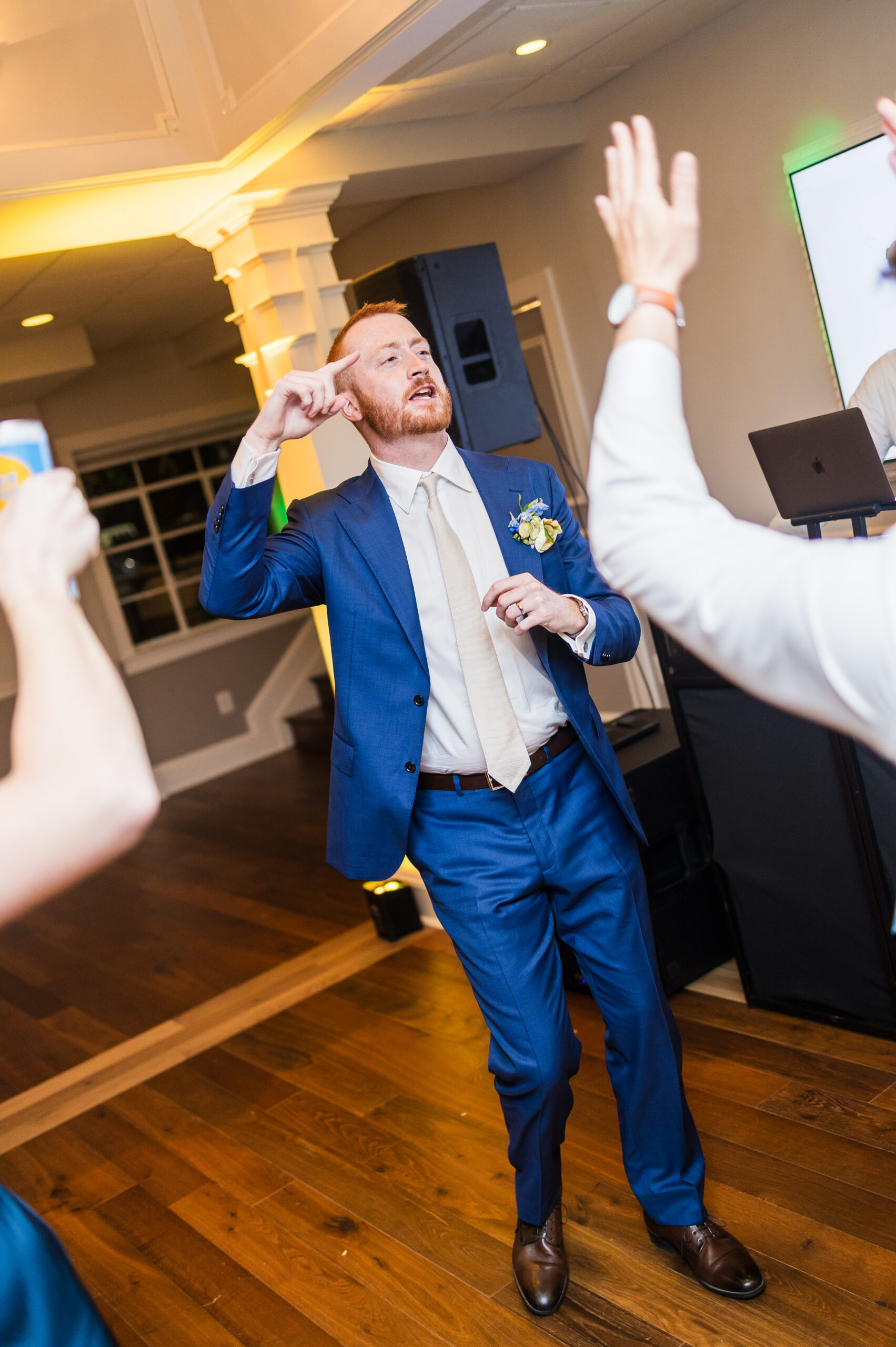 Groom dancing at wedding reception captured at Herrington on the Bay in Maryland