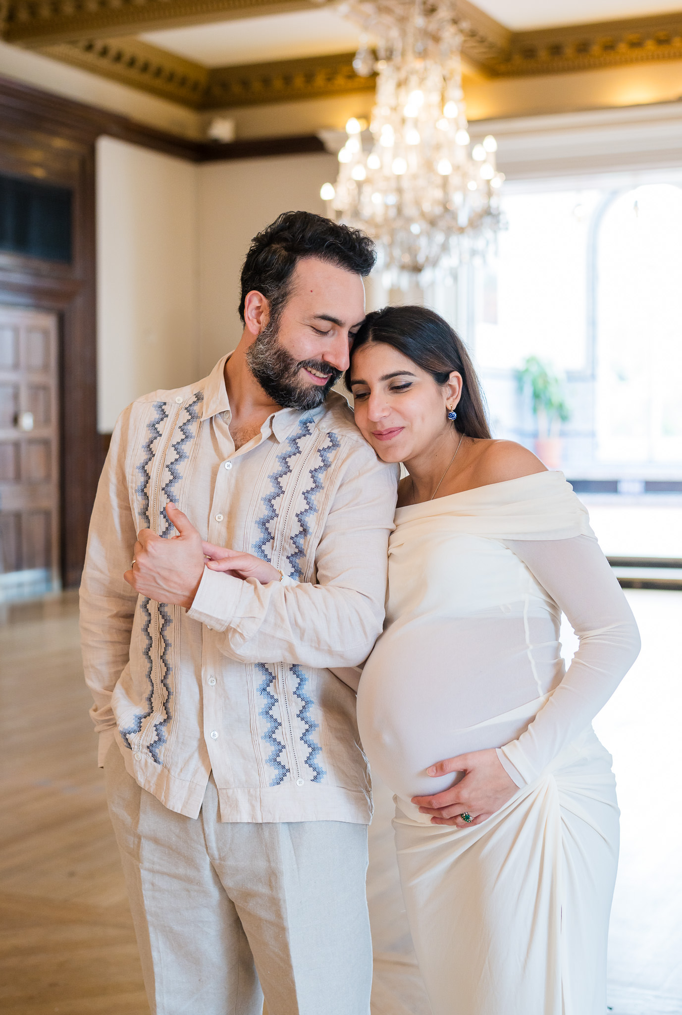 Romantic maternity portrait of an expecting couple at the Mexican Cultural Institute in Washington, DC.