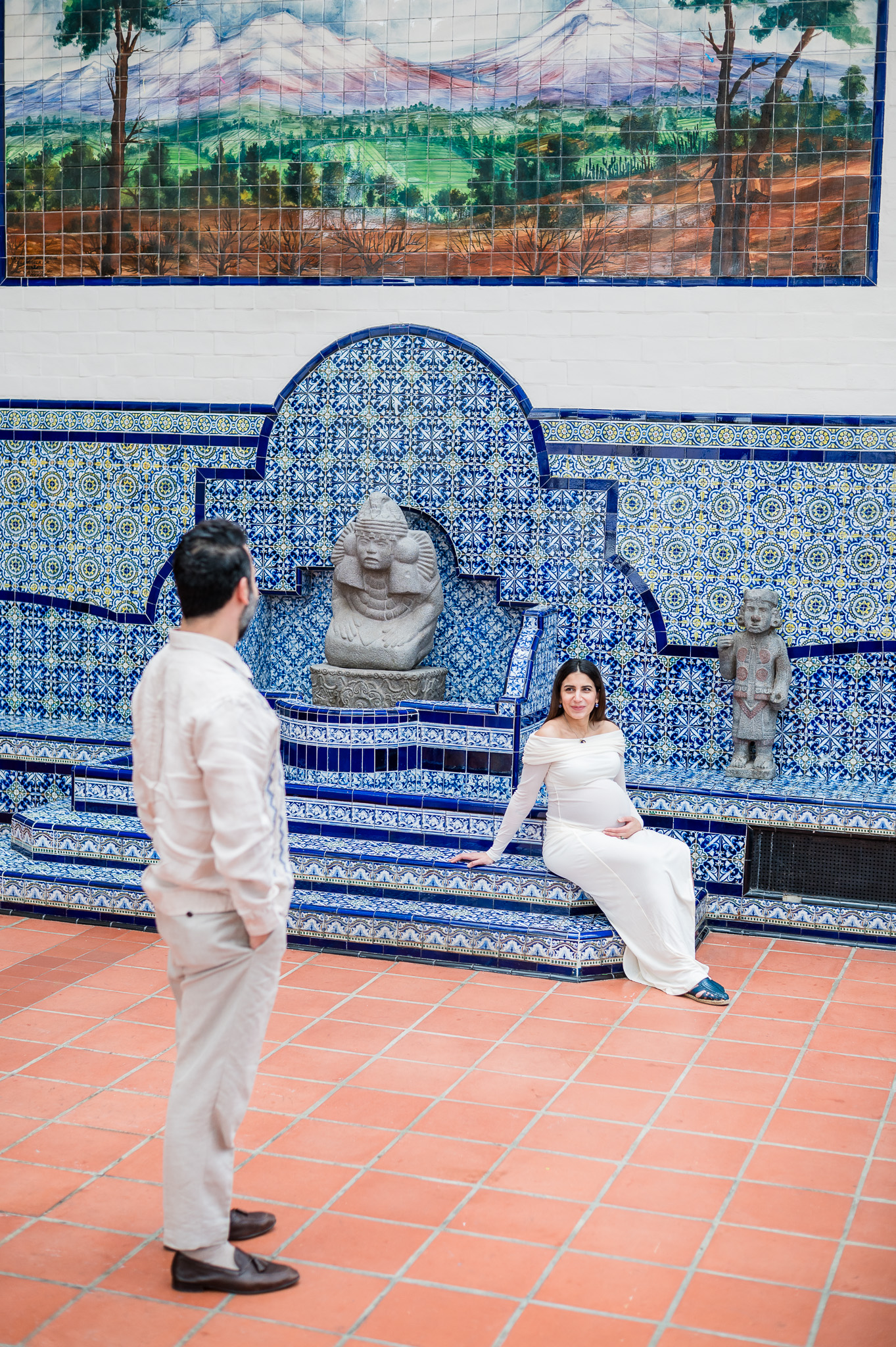 Mother to be smiling at her husband during a maternity session indoors in DC