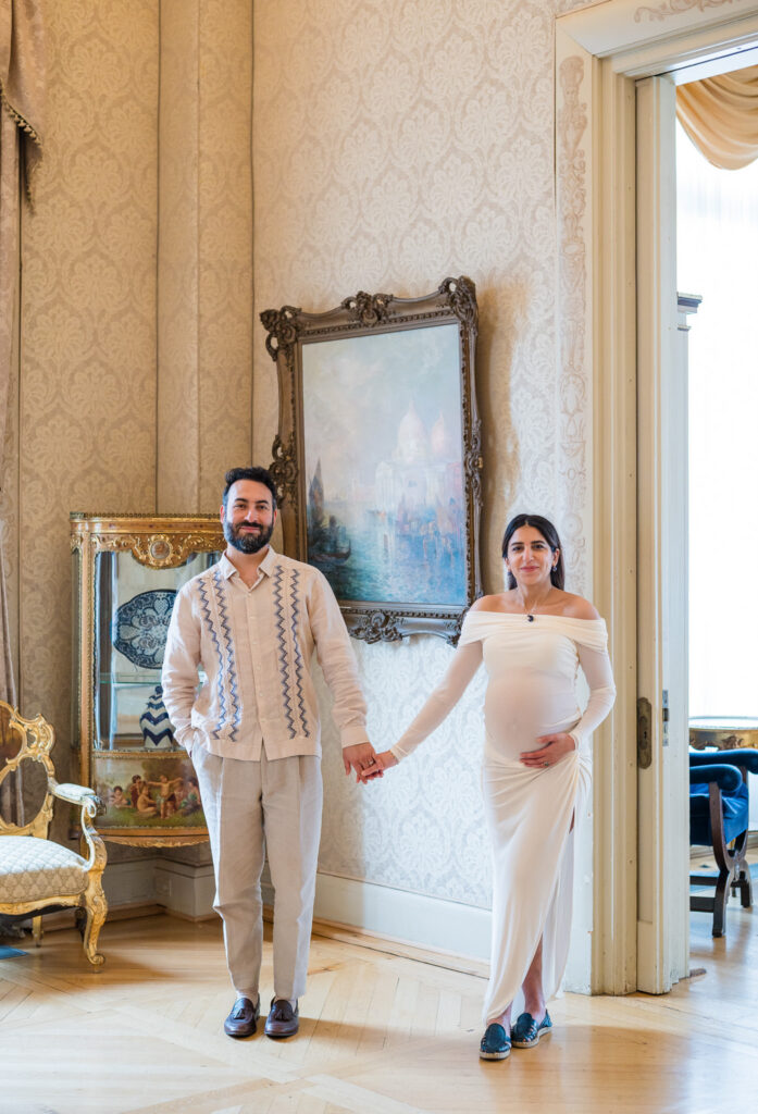 Expecting parents holding hands during their maternity session in DC.