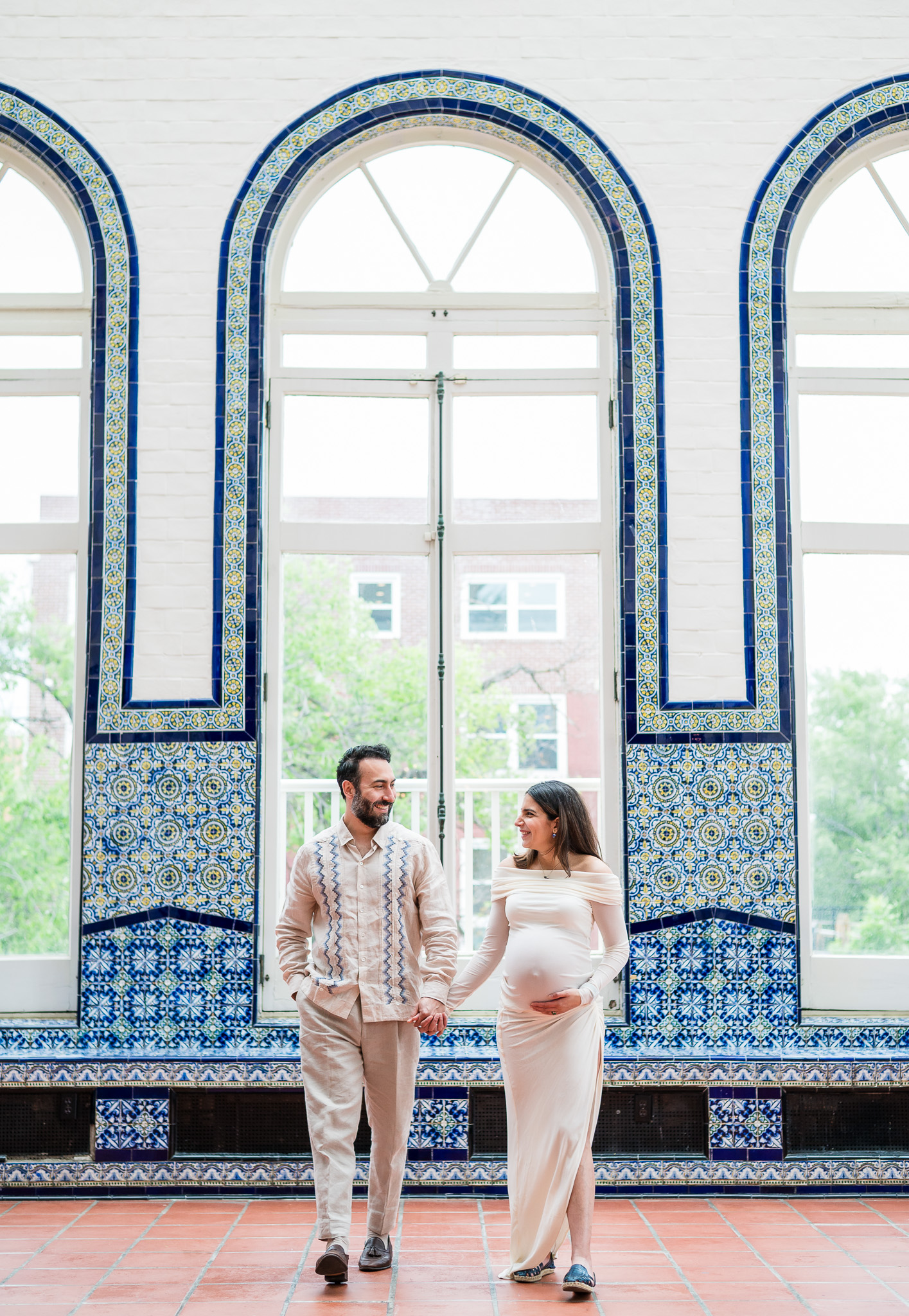 Lifestyle maternity session capturing genuine moments between expecting parents.
