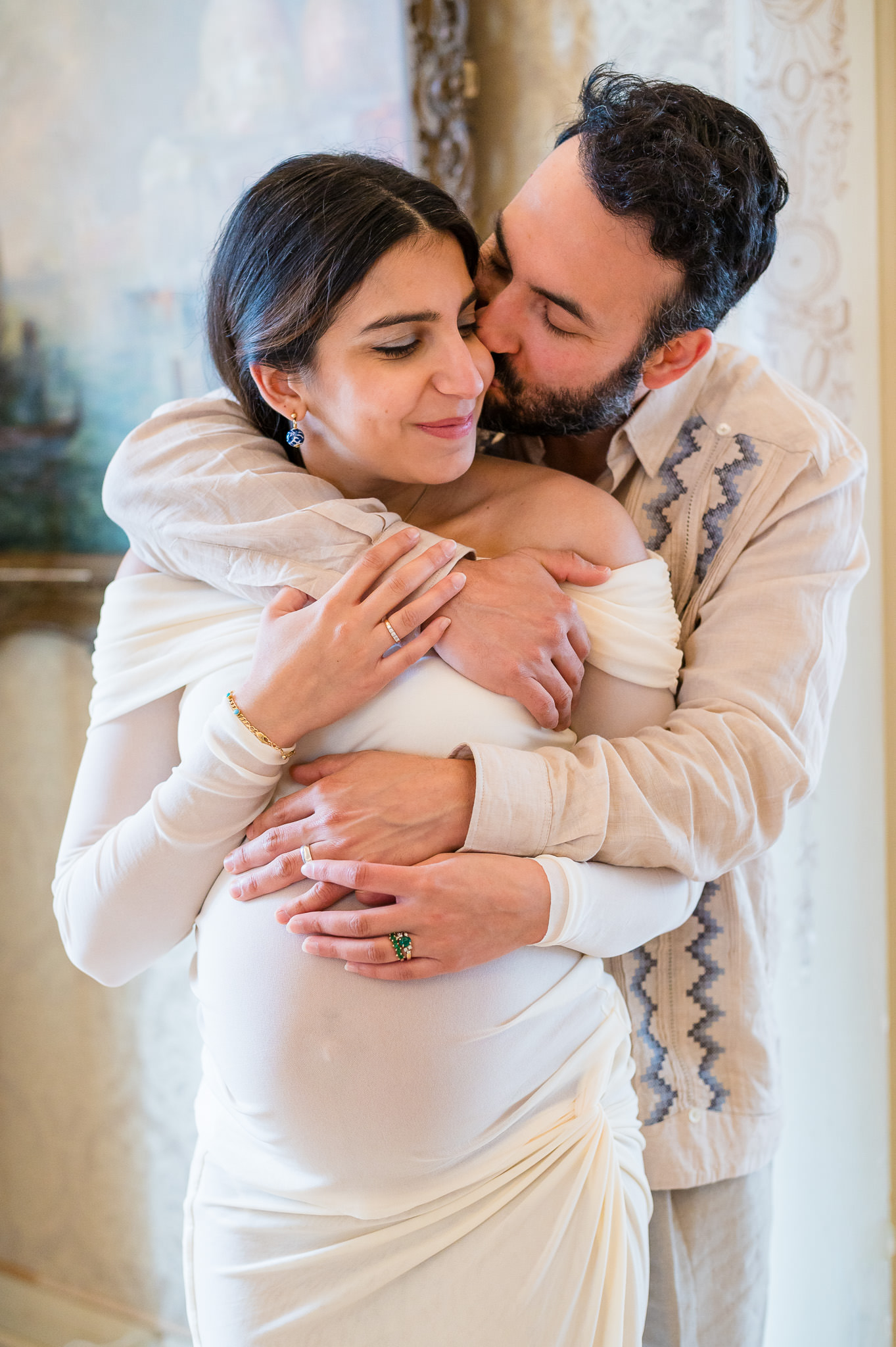 Husband wrapping his arms around his pregnant wife during a maternity session in Washington D.C