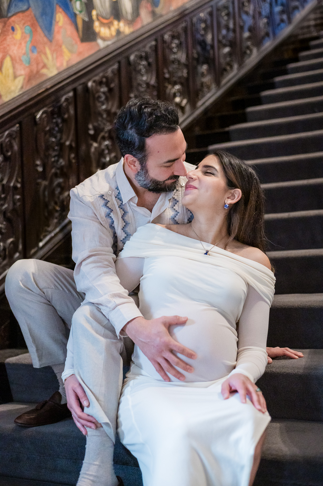 Joyful maternity portrait of an expecting couple celebrating this new chapter together.