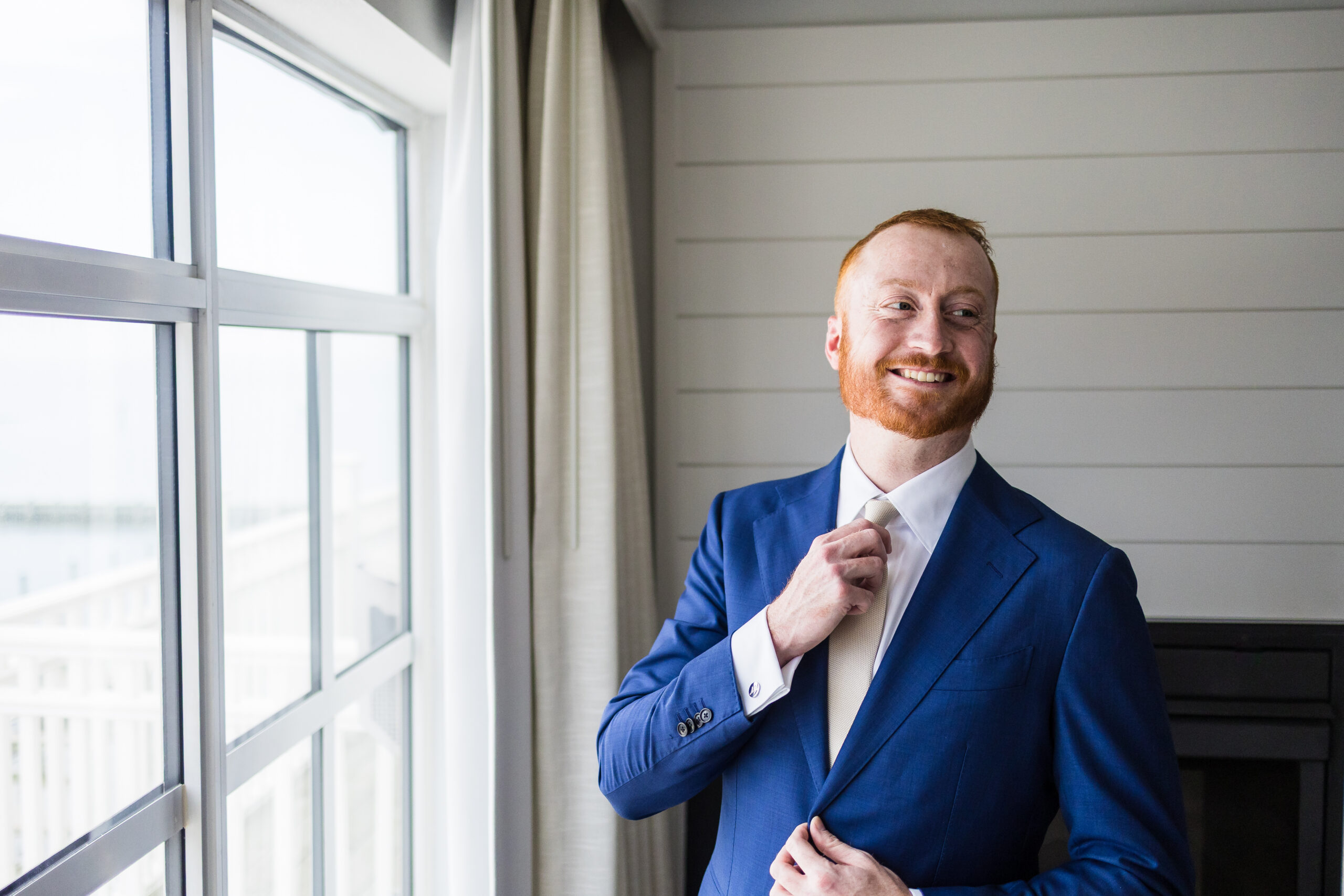 Groom getting ready at Rod N Reel Resort in North Beach Maryland